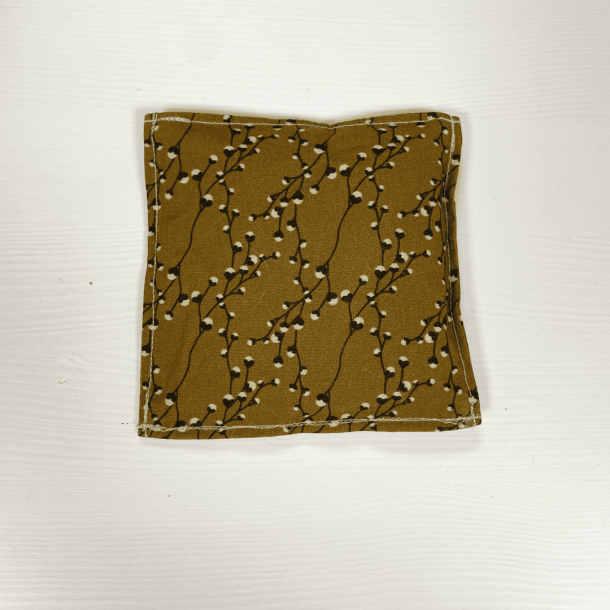 Brun sansepose med grenmotiver